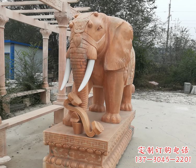 湖南鼻卷如意的大象晚霞红门口镇宅石雕
