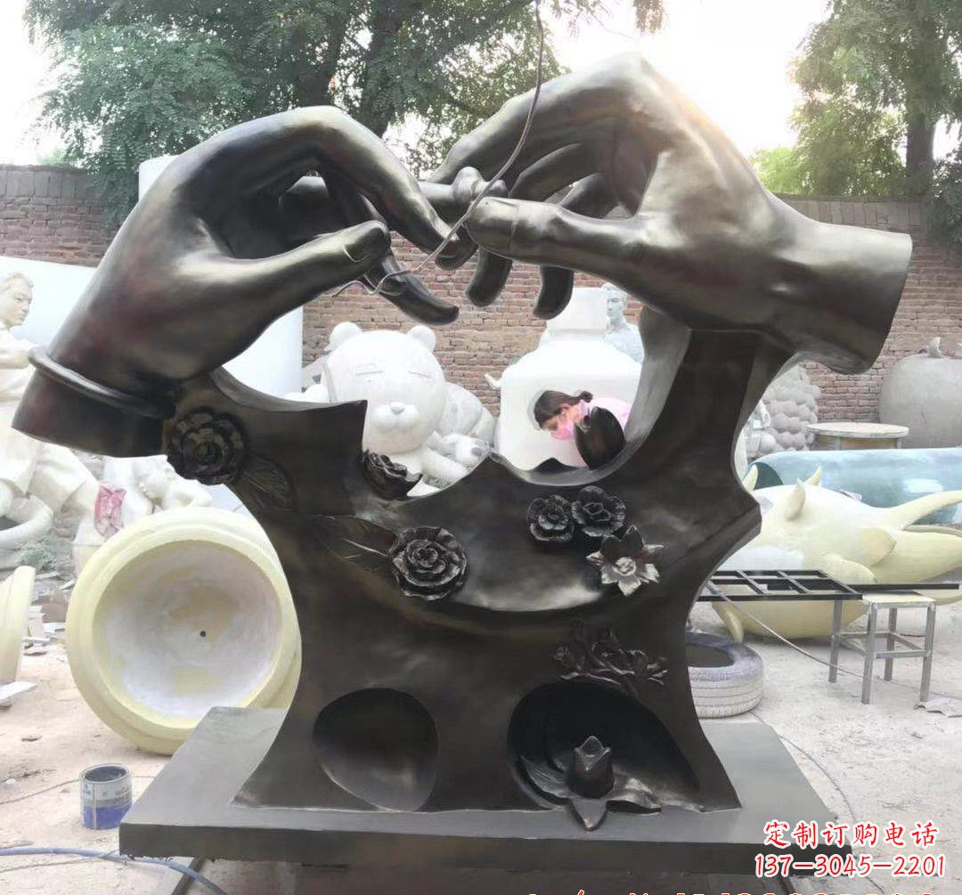 湖南戴戒指景观铜雕