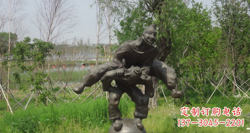湖南园林站在球上面跳山羊的人物景观铜雕